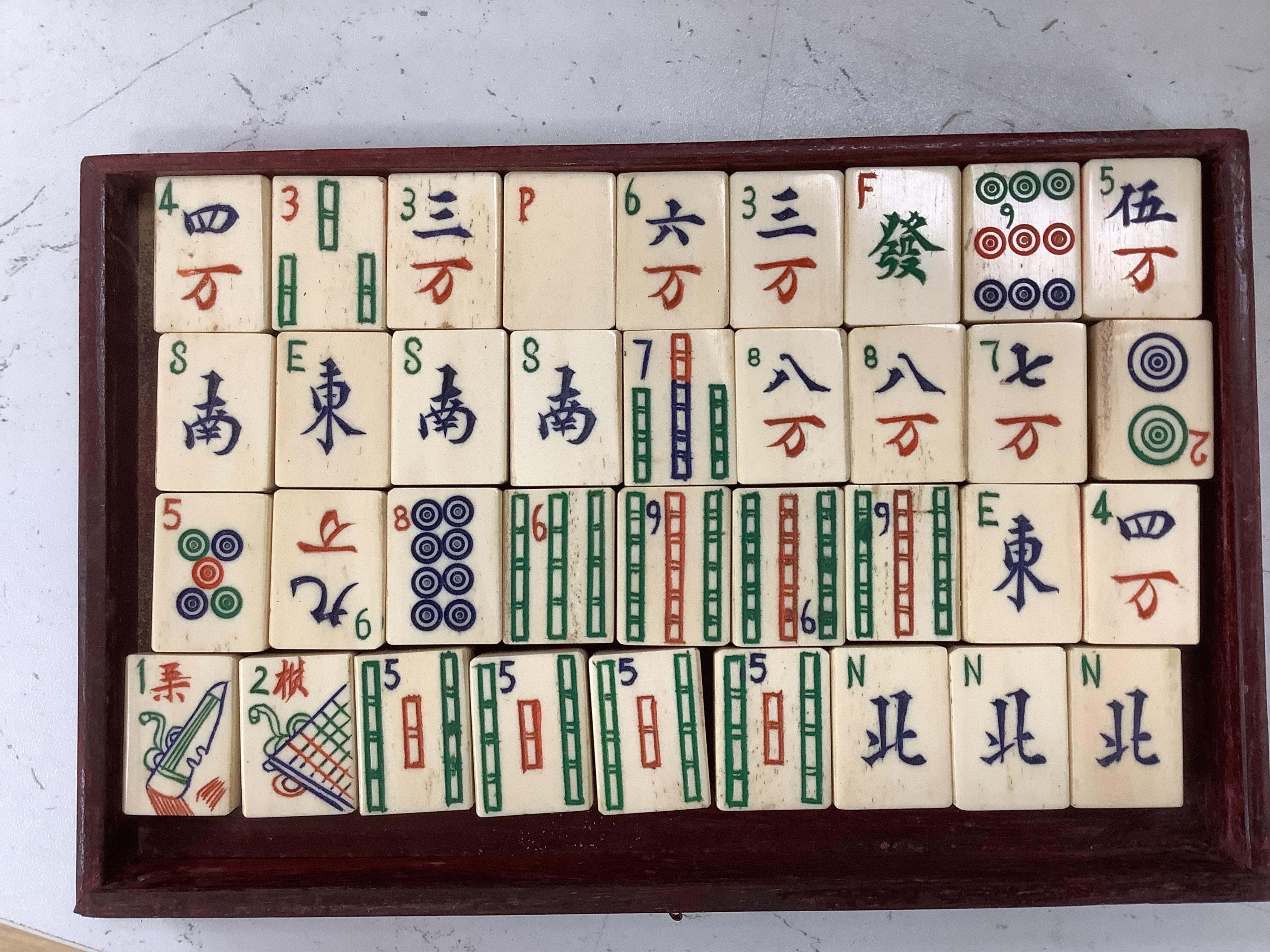 An early 20th century Chinese cased mah jong set, 20cm wide x 17cm high
